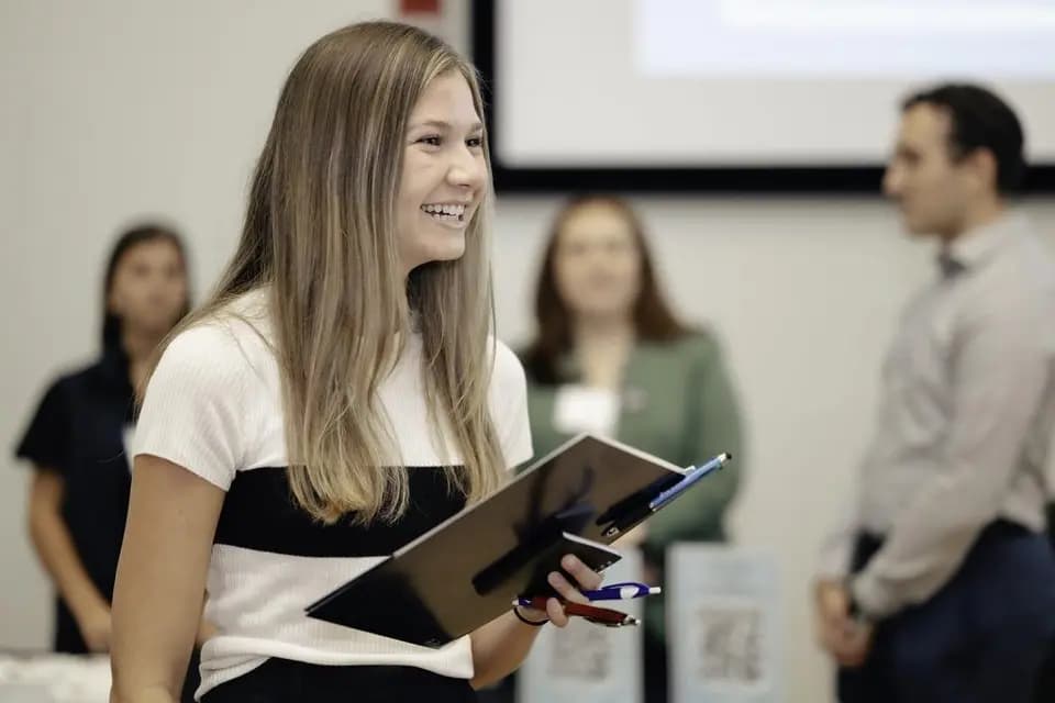 Brianna Linehan attends a recent career expo at the University of Connecticut's School of Business. The job market for Gen Z is harder than it has been in years, economists say.