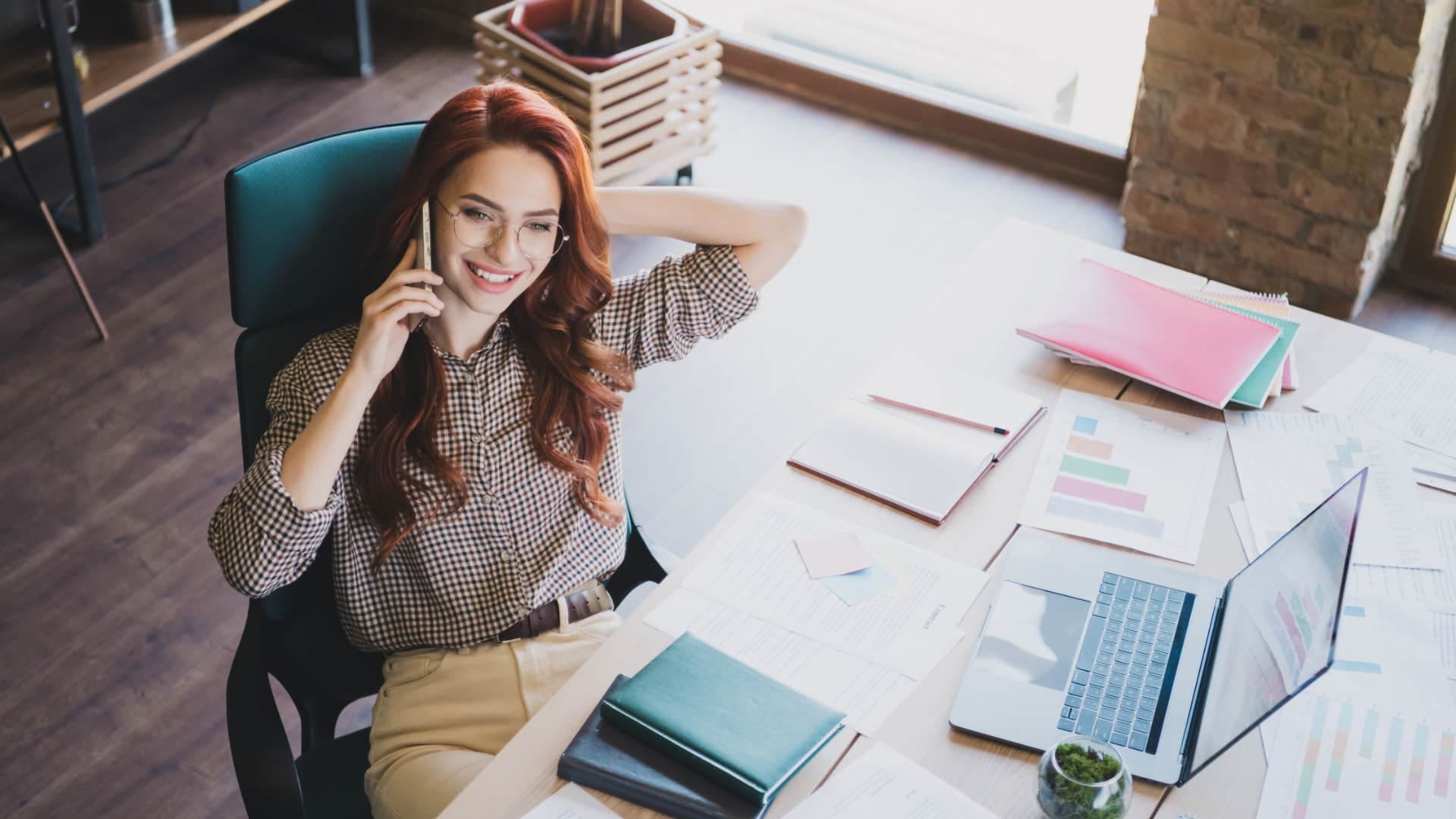 sales representative on the phone with client in the office